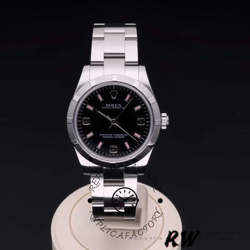 Rolex Oyster Perpetual 177210, front view on stand showing black dial and steel bracelet.