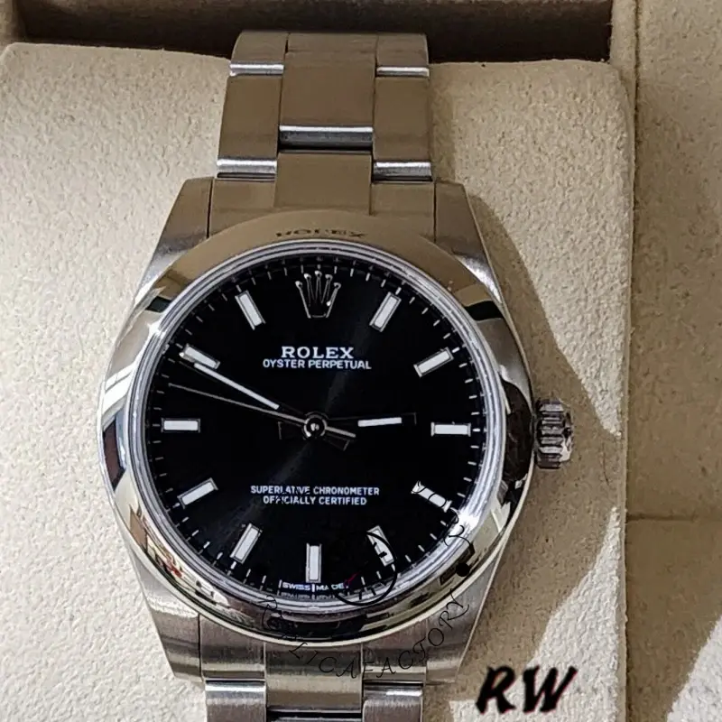 Rolex Oyster Perpetual 177200, close-up on cushion, black index dial, 31mm.
