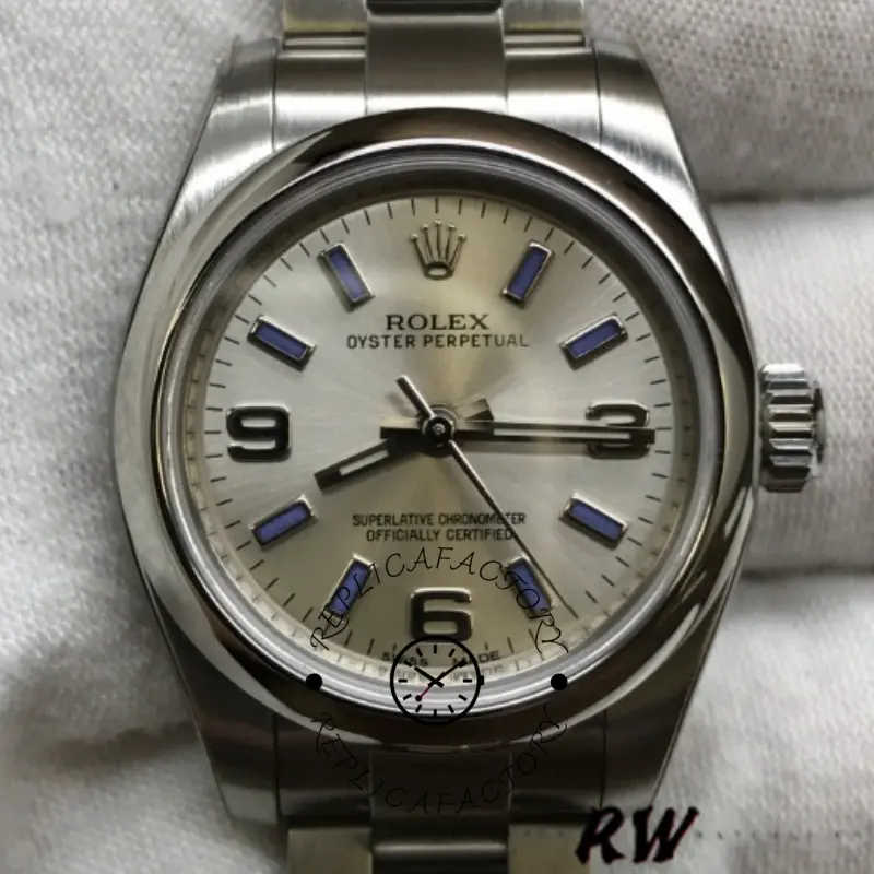Rolex Oyster Perpetual 176200 close-up, silver dial with blue markers, angled view.