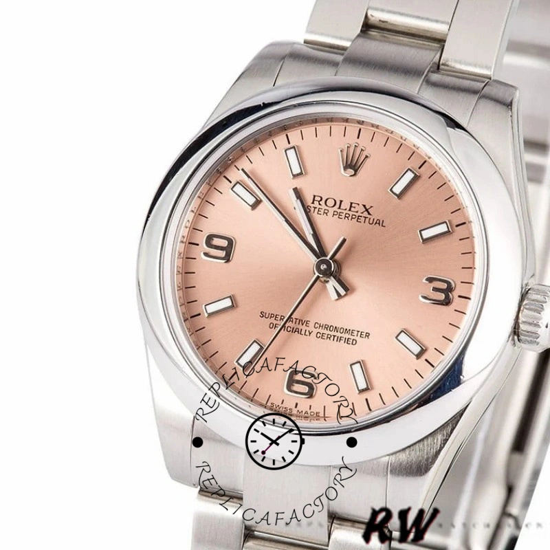 Rolex Oyster Perpetual 177200, pink dial, angled close-up showing bezel and case profile.