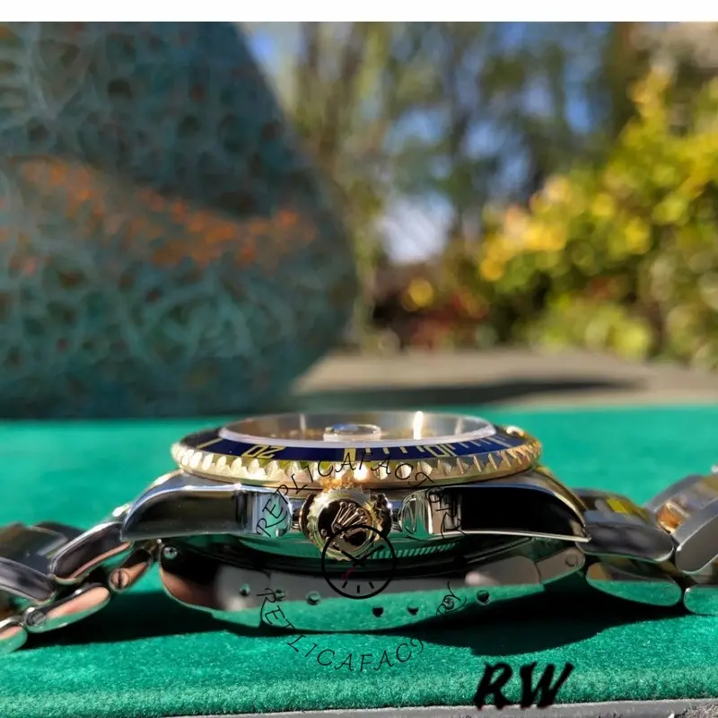 Rolex Submariner Date 16613, side profile on cushion showing crown and blue bezel edge.