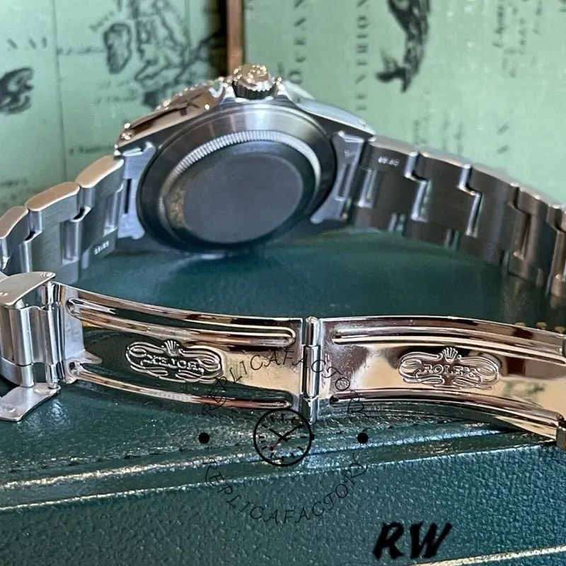 Rolex Submariner 16610, clasp detail showing stainless steel bracelet and buckle.