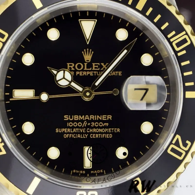 Rolex Submariner 16613LN, close-up of black dial with date cyclops and gold markers.