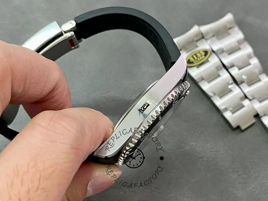 Rolex Submariner 126610LN, strap and clasp side view, showing rubber strap curve.