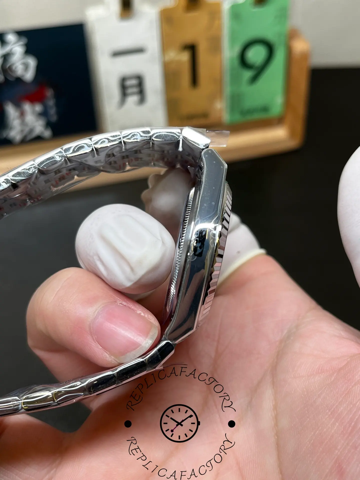 Side profile of Rolex Land-Dweller 36 m127236-0001 showing the case thickness and fluted bezel edge.