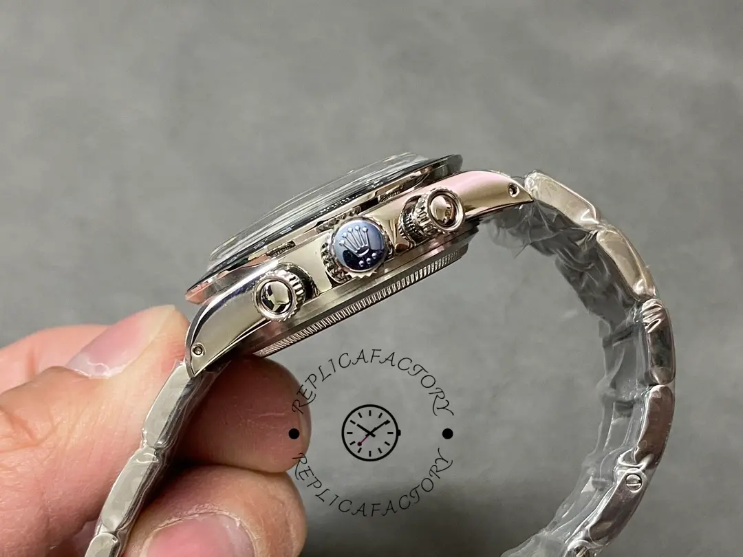 Side profile of Rolex Daytona 6241 in hand, showing crown and bezel edge.