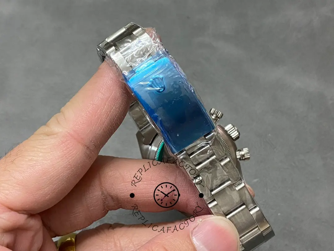 Bracelet close-up of Rolex Daytona 6241 showing clasp links with blue protective film.