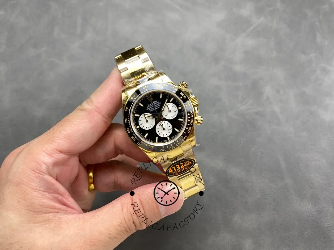Rolex Daytona 126528LN-0001, full watch in hand showing bracelet and dial layout.