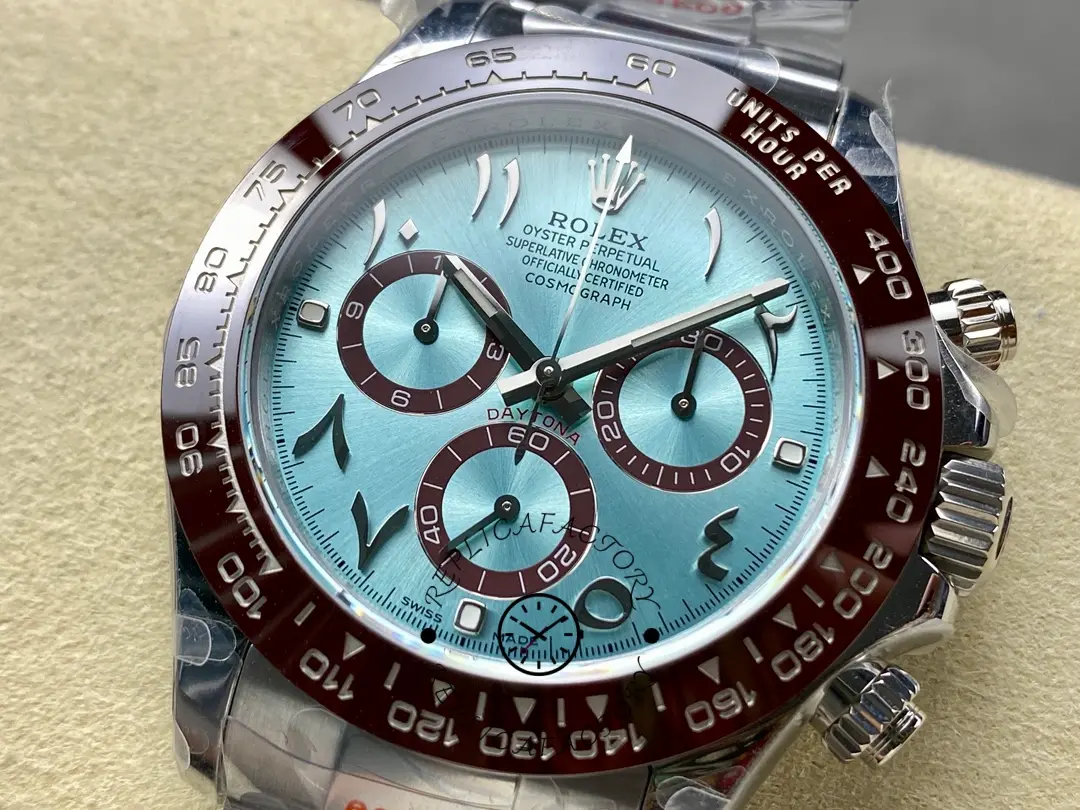 Angled dial close-up of Rolex Daytona Arabic 116506 showing bezel edge and crystal.