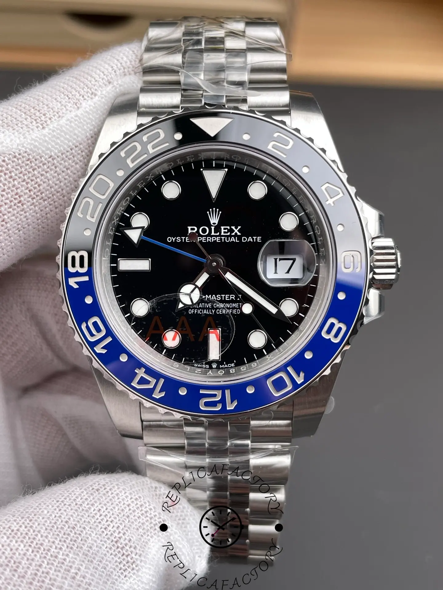 VSF Rolex GMT-Master II 126710BLNR close-up dial with cyclops date and bezel scale.